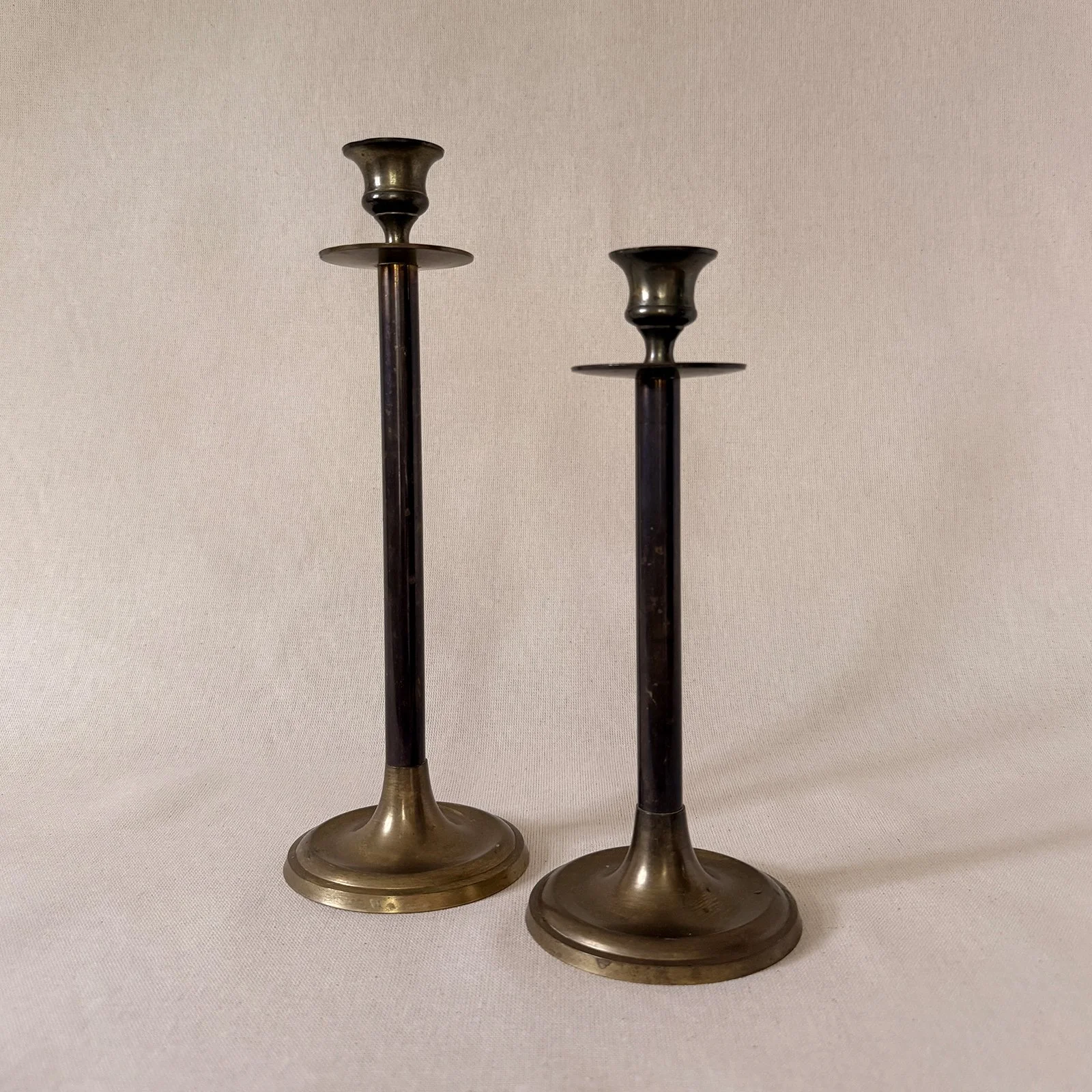 staggered brass candlesticks