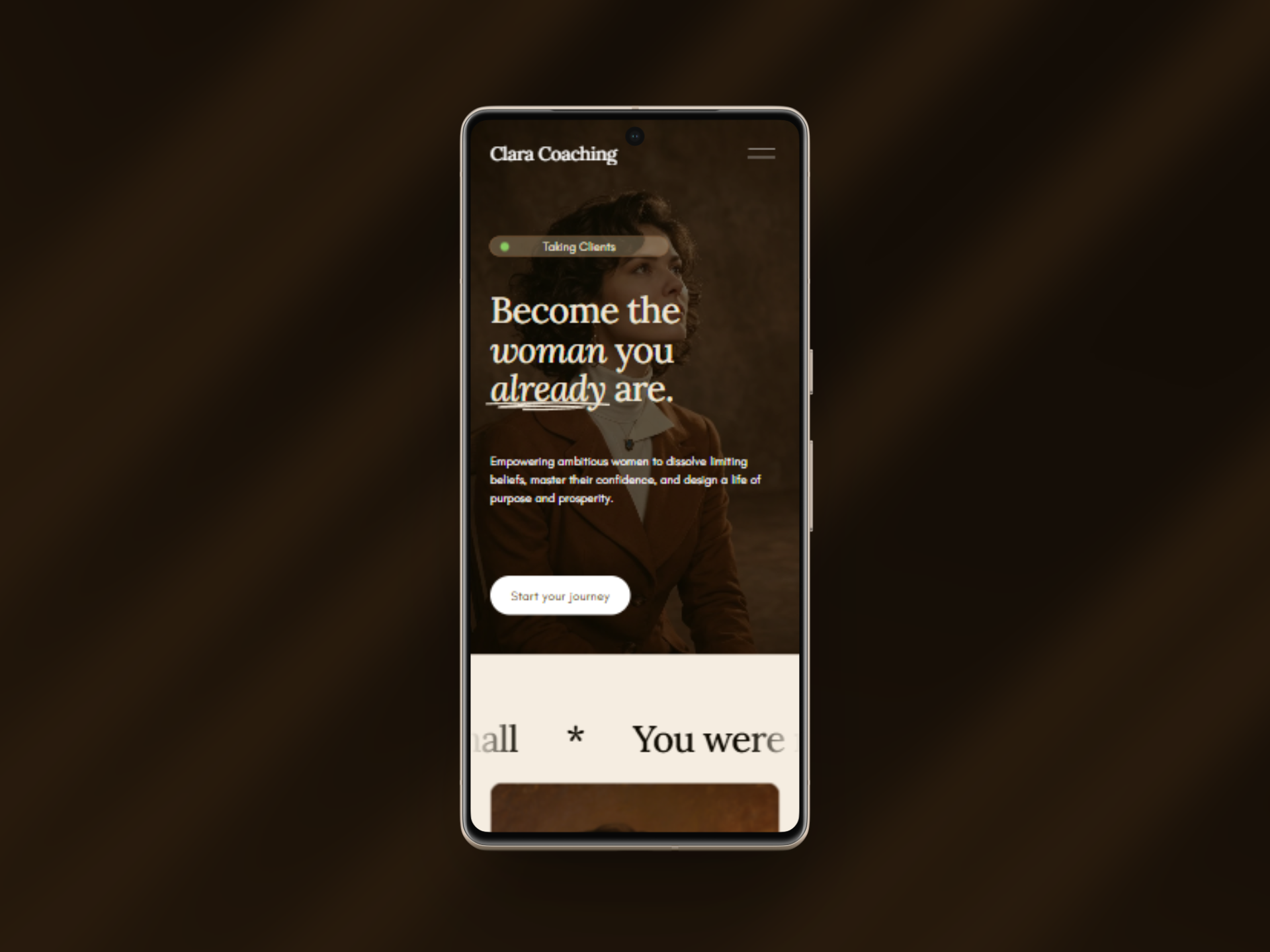 A smartphone displaying a coaching or coaching-related app with text 'Become the woman you already are.' and a button to start a journey.