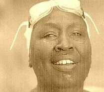 Close-up of a smiling person wearing goggles on head