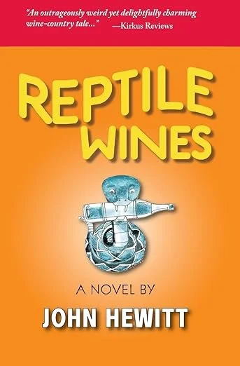 Book cover titled 'Reptile Wines' by John Hewitt with an orange background, featuring a cartoonish blue reptile holding a wine bottle. Book & Author Publicity by Quatrain PR.
