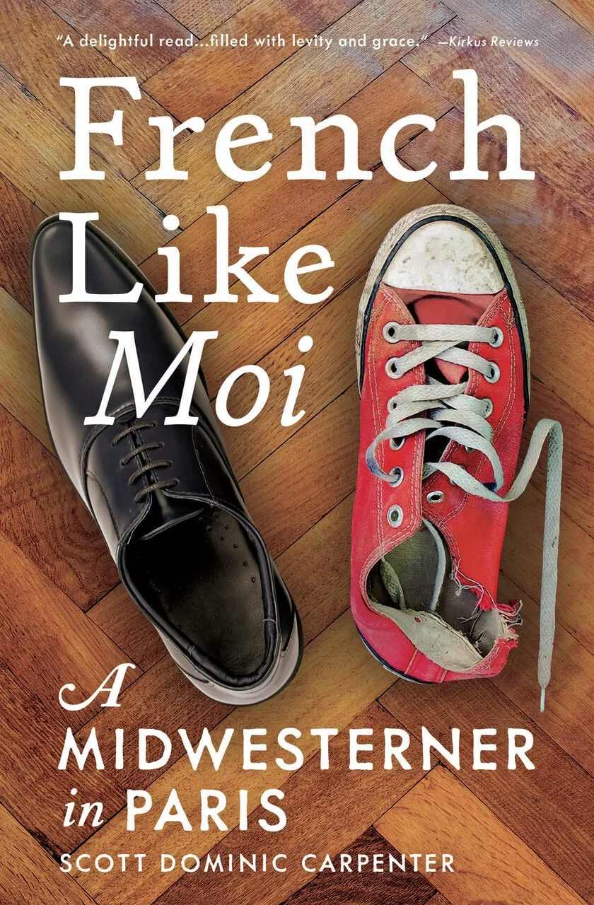 The cover of a book titled 'French Like Moi: A Midwesterner in Paris' by Scott Dominic Carpenter, featuring one polished black dress shoe and one worn-out red sneaker with white laces on a wooden floor. Book & Author Publicity by Quatrain PR.