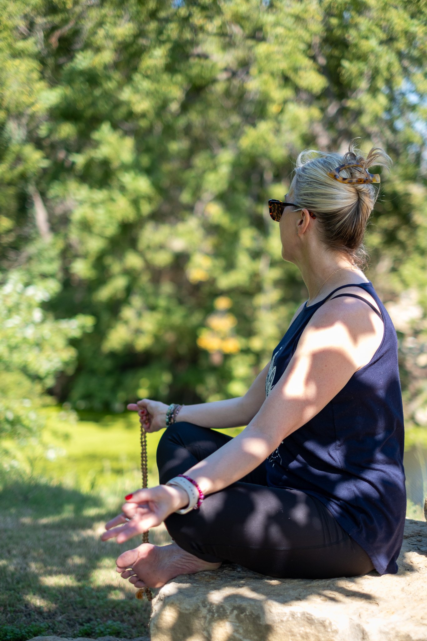 Angie meditating outside