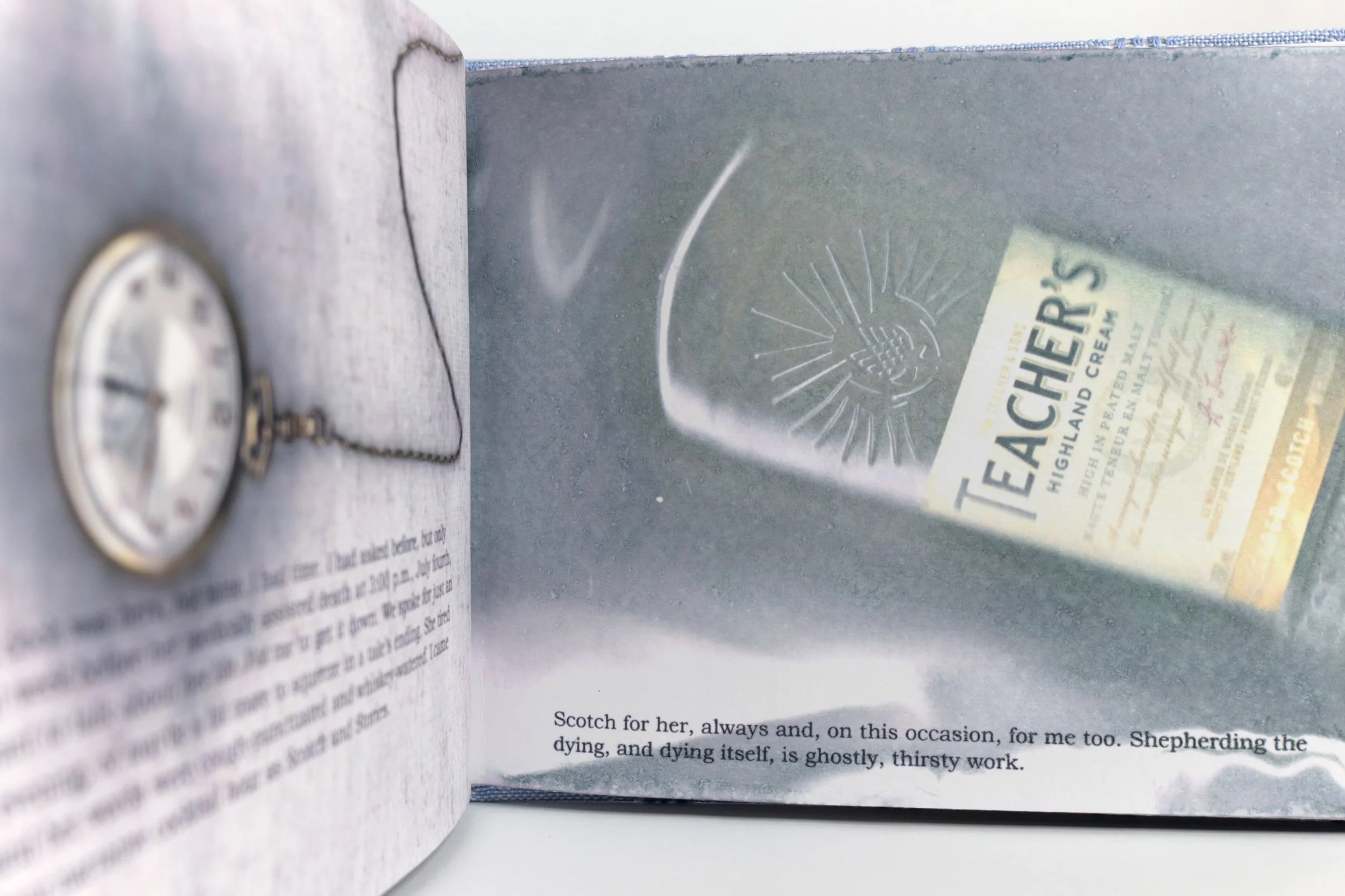 Open book with a pocket watch and a tea label. The text on the page says: 'Scotch for her, always and, on this occasion, for me too. Shepherding the dying, and dying itself, is ghostly, thirsty work.'