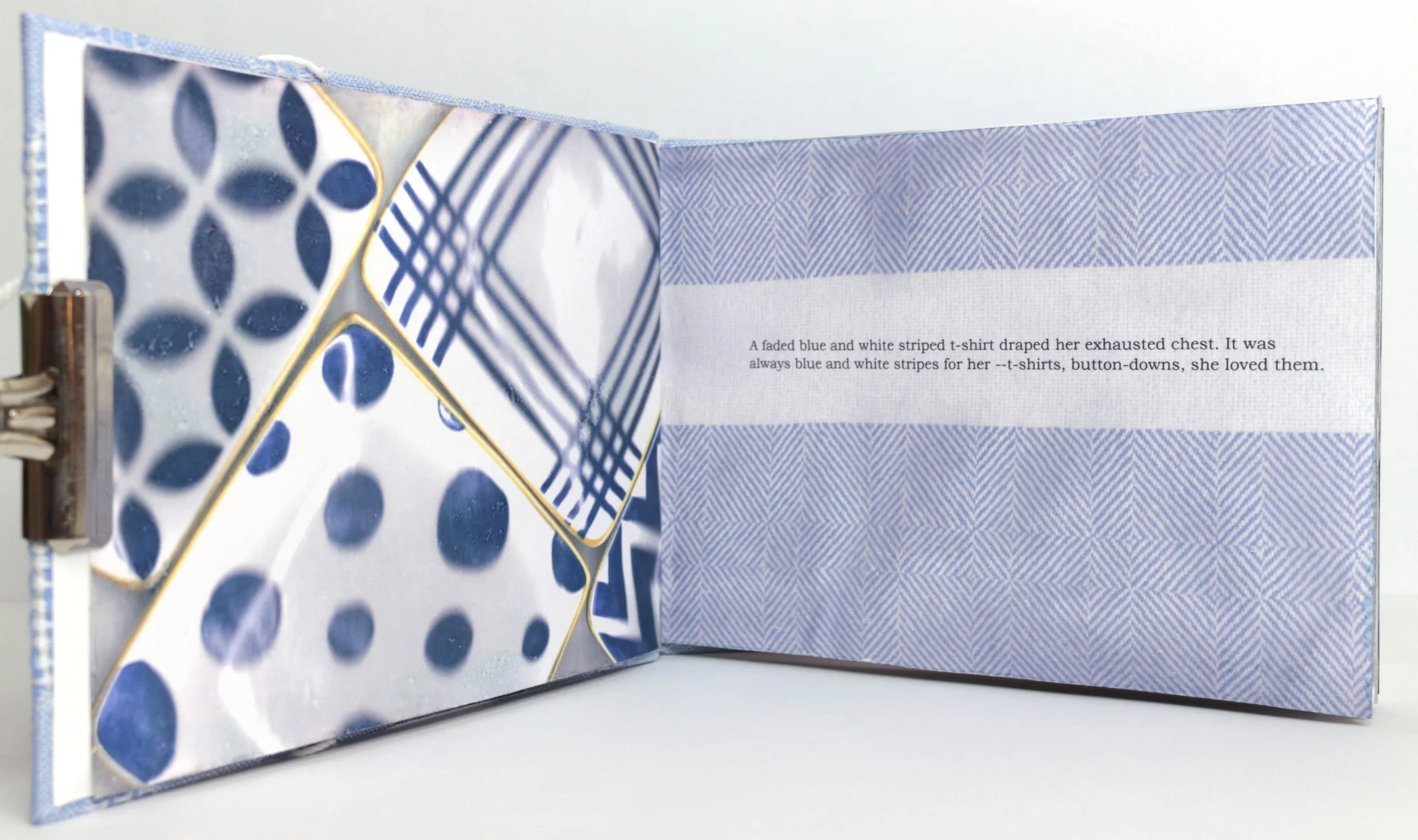 Open blue and white striped book with patterned pages and a quote about a faded blue and white striped T-shirt inside.