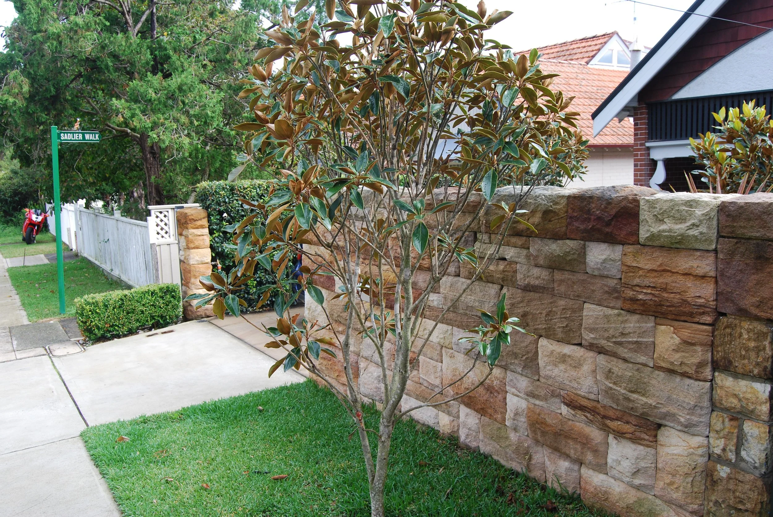 Dry stack sandstone front fence