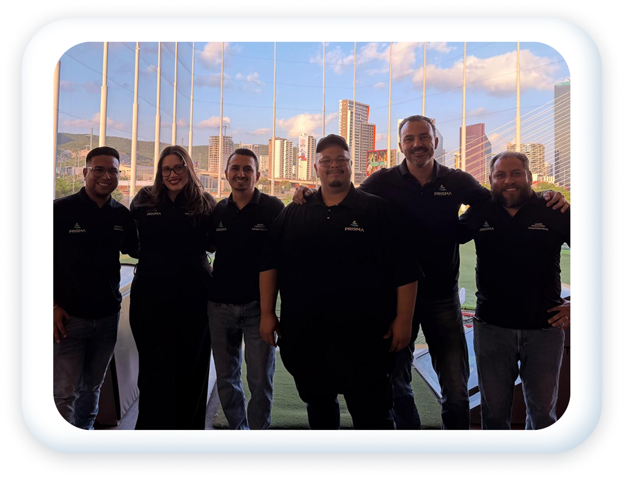 Group of six people in black shirts standing outdoors with a city skyline and a bridge in the background.