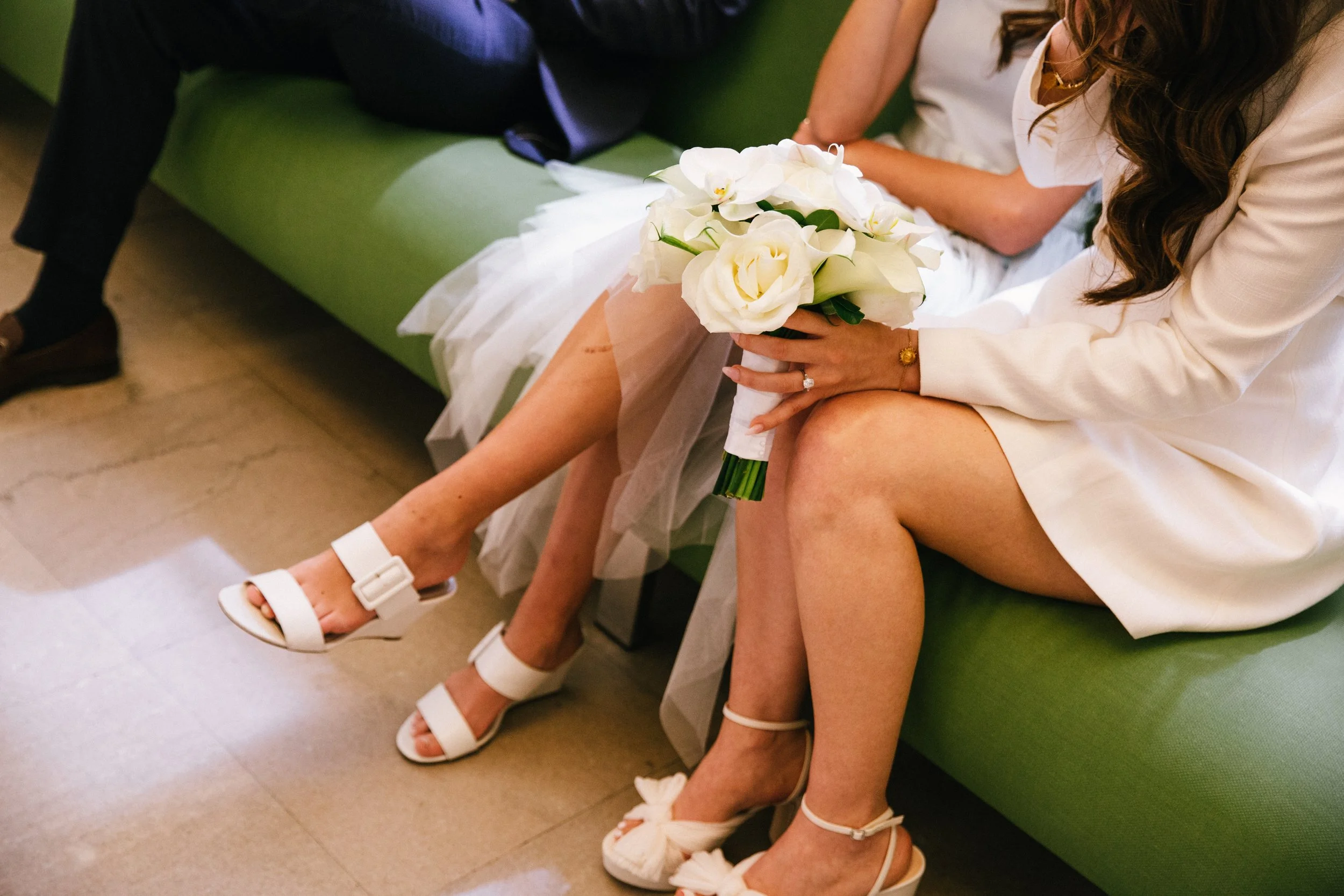 close up of bride and flower girl waiting in the nyc courthouse wedding hall