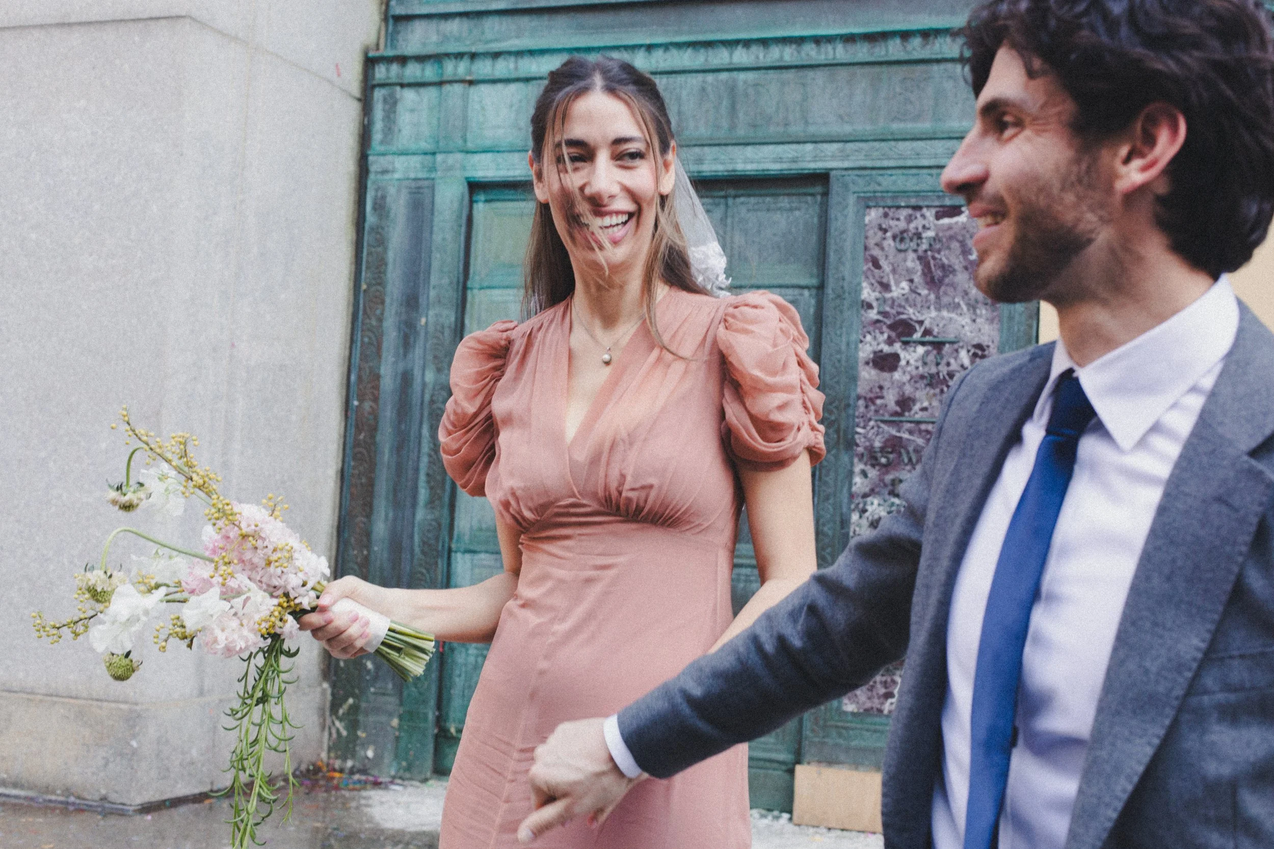 Couple exiting Manhattan Marriage Bureau after NYC courthouse wedding on film