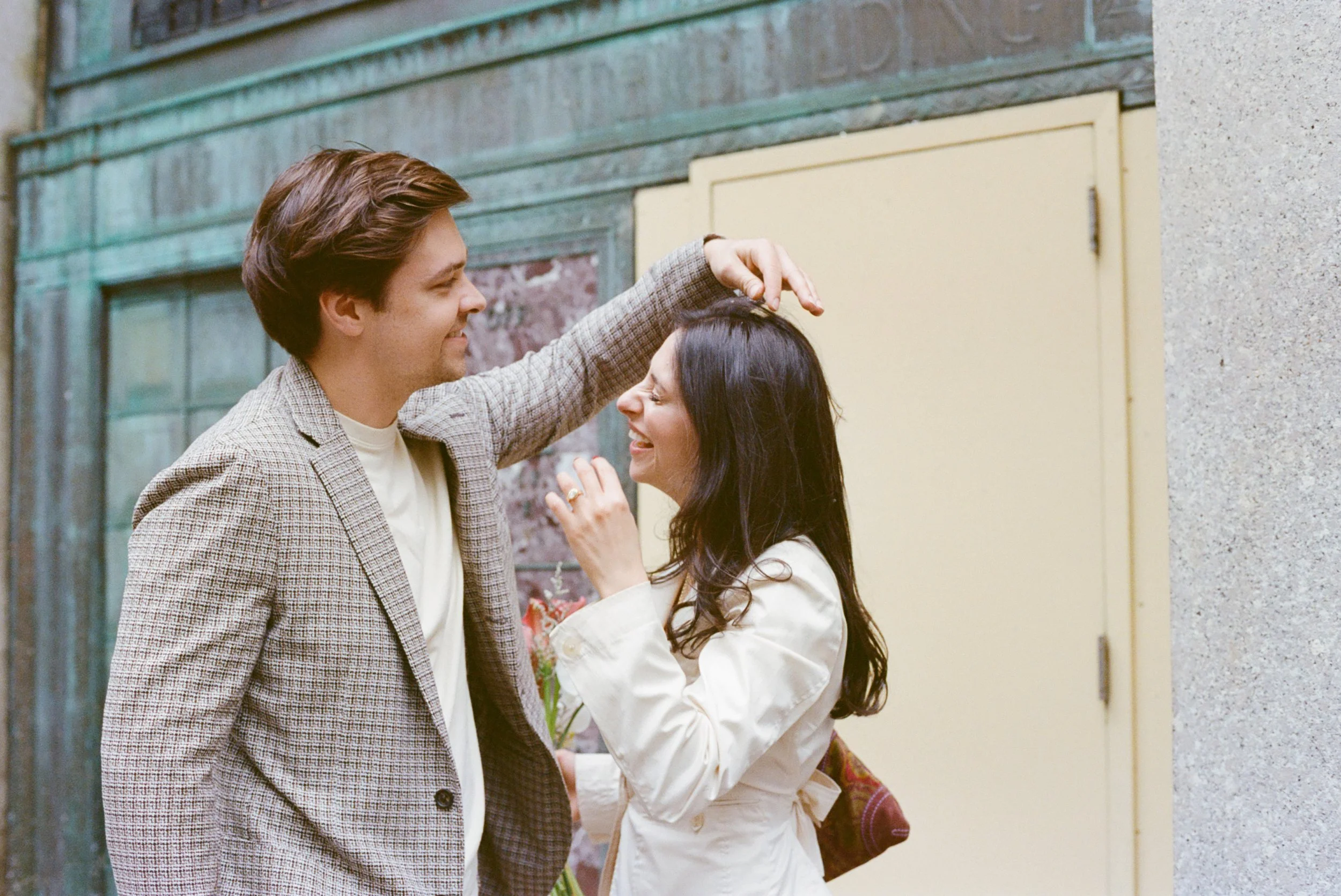 candid moment of young couple outside of nyc courthouse wedding