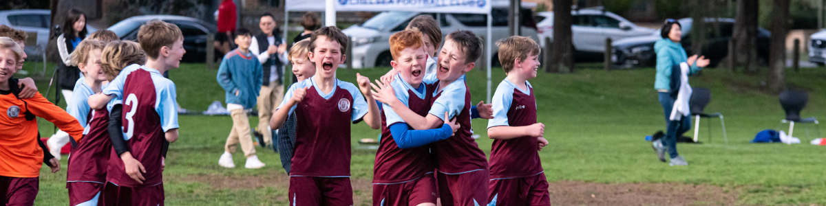 Junior community soccer game in Melbourne — players developing skills in a local club environment
