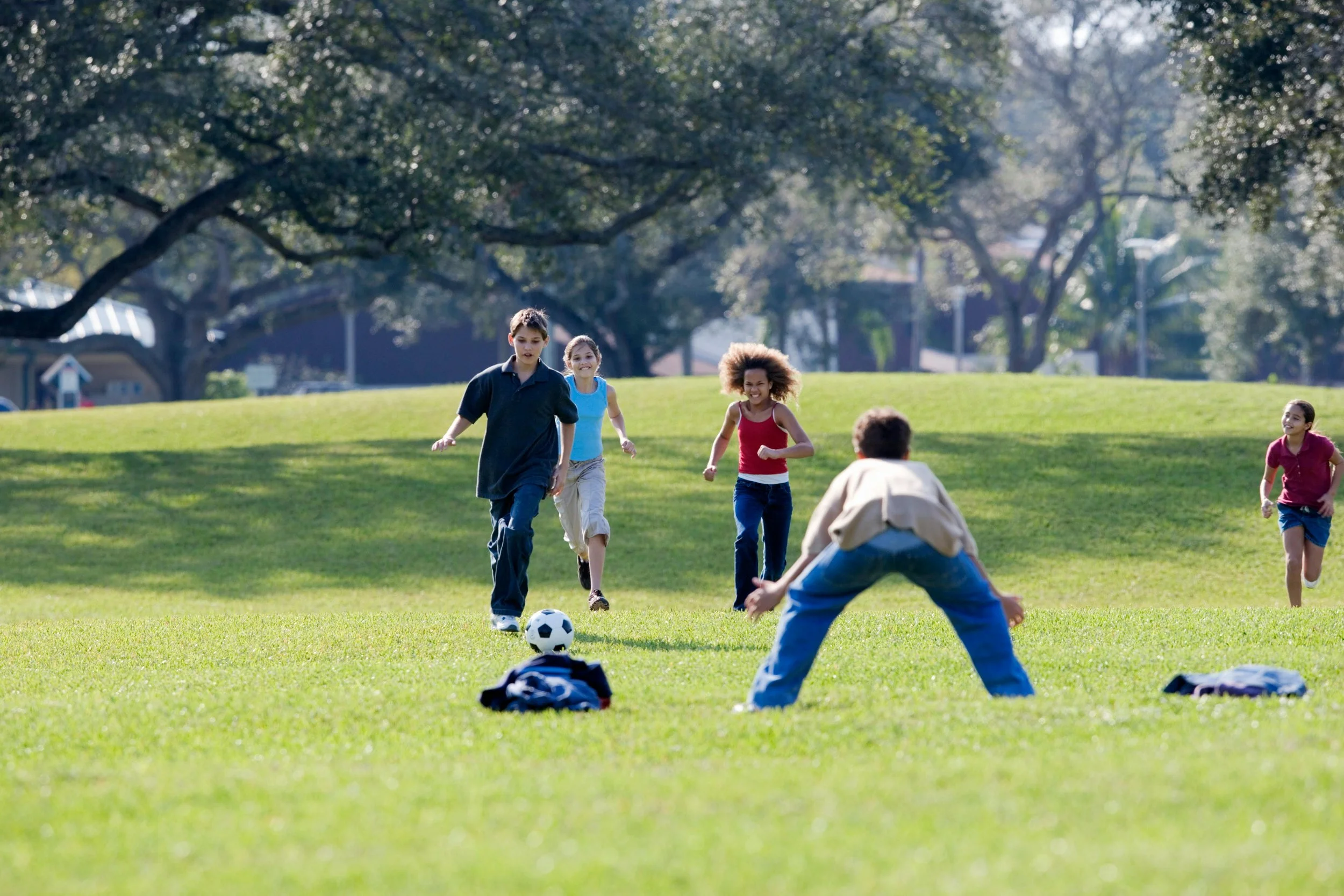 Kids playing soccer in the park in Melbourne
