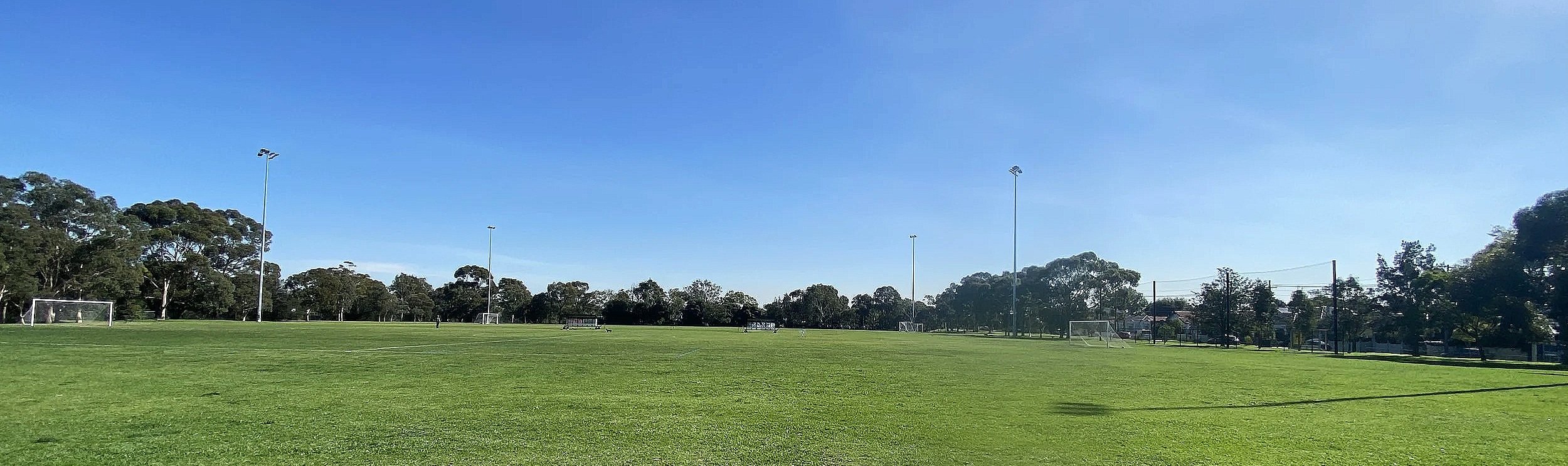 Two full-sized soccer fields with goals with nets at Mayer Park in Melbourne.