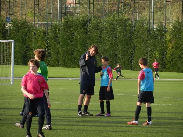 Soccer coach working with youth players at training in Melbourne