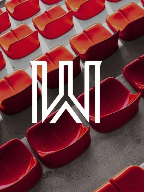 Red and orange stadium seats with a white logo overlay.