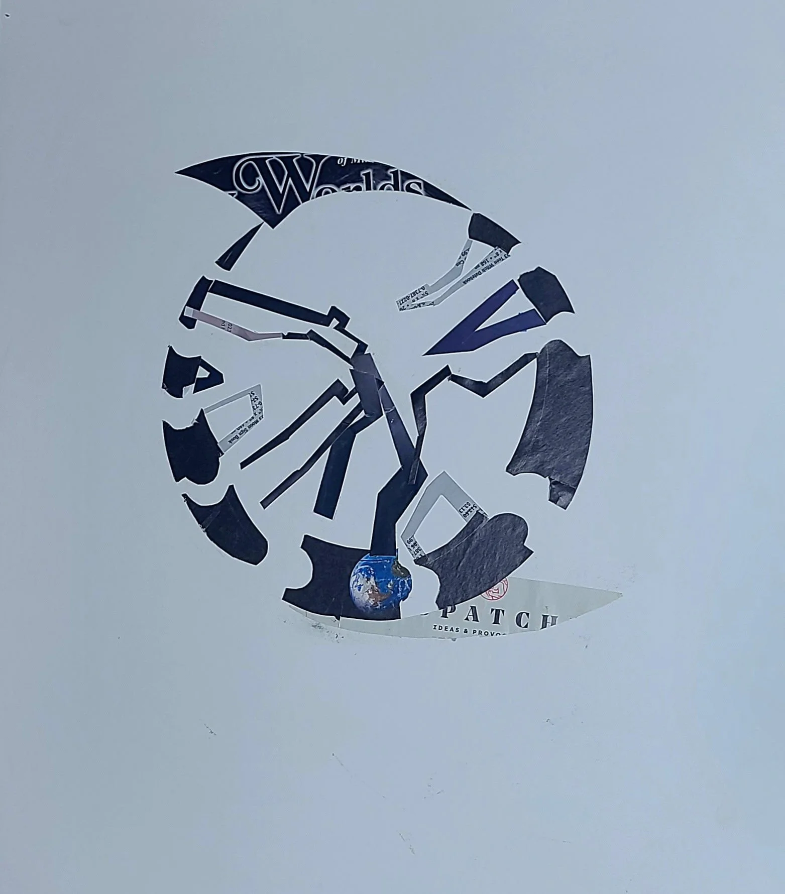 Broken sticker on a white surface with parts of a logo and text visible, including the Earth at the bottom and the word 'PATCH'.