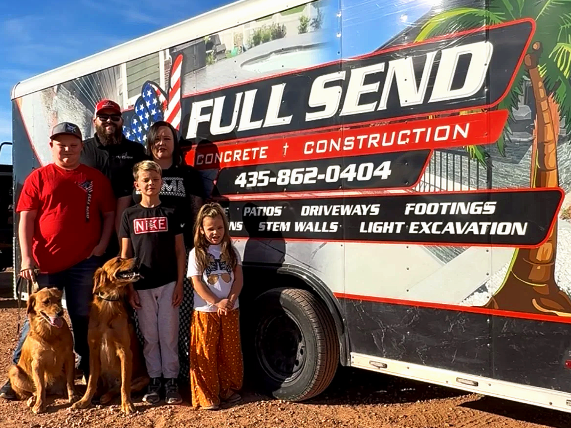 Family-owned Full Send Concrete team standing in front of branded truck and trailer in St George Utah