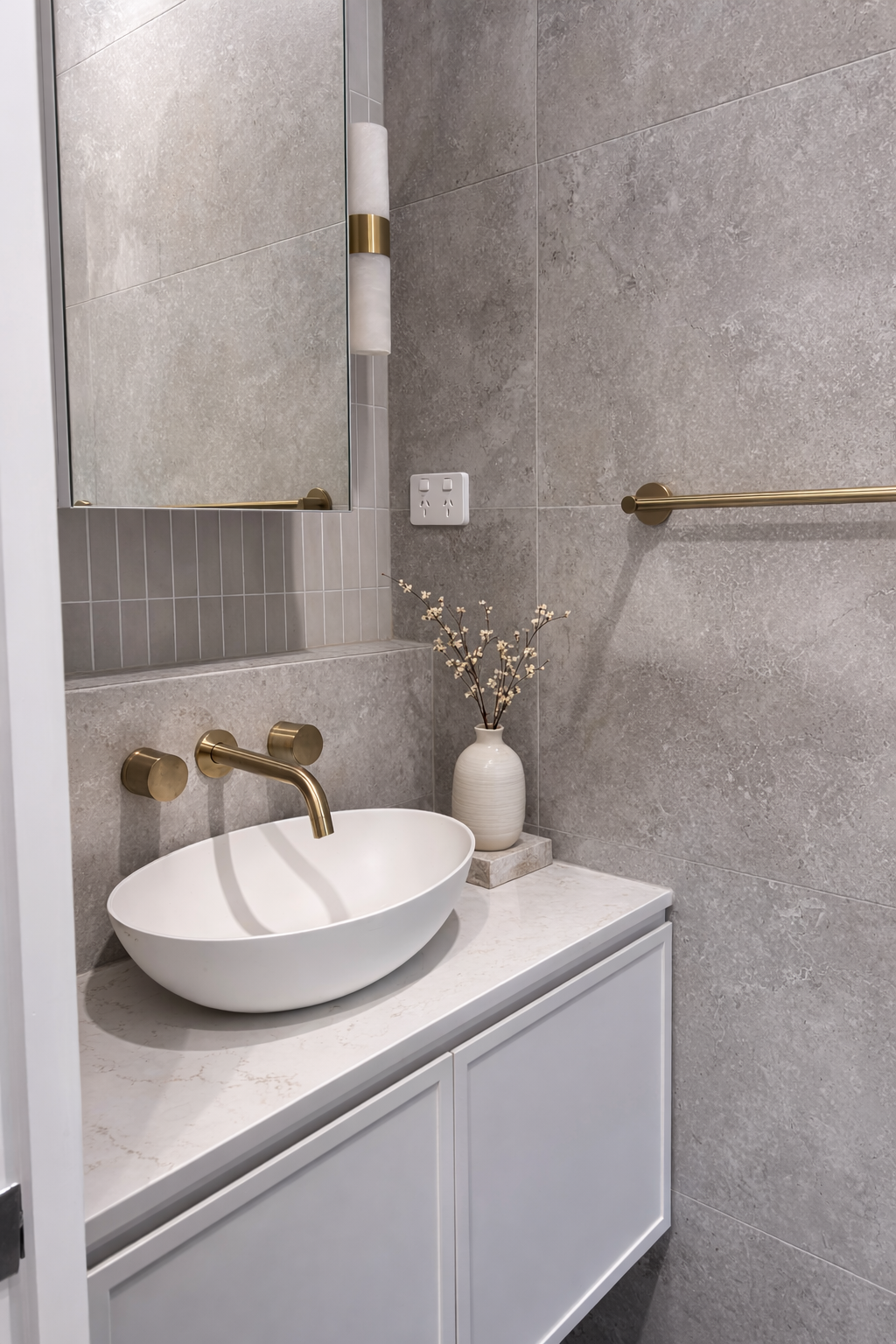 Minimalist bathroom with brass accents (1).png