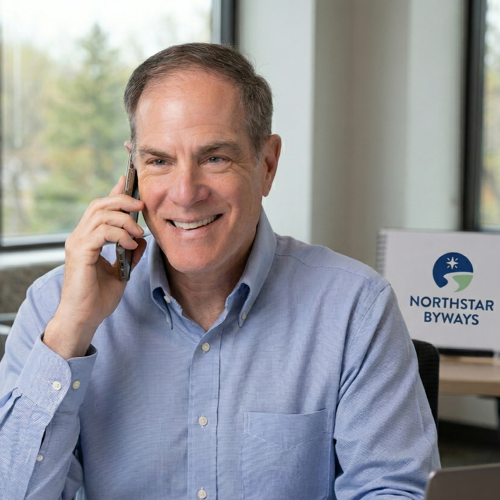 Dave Rosen Founder and Managing Principal of Northstar Byways LLC engaging with a client by phone.