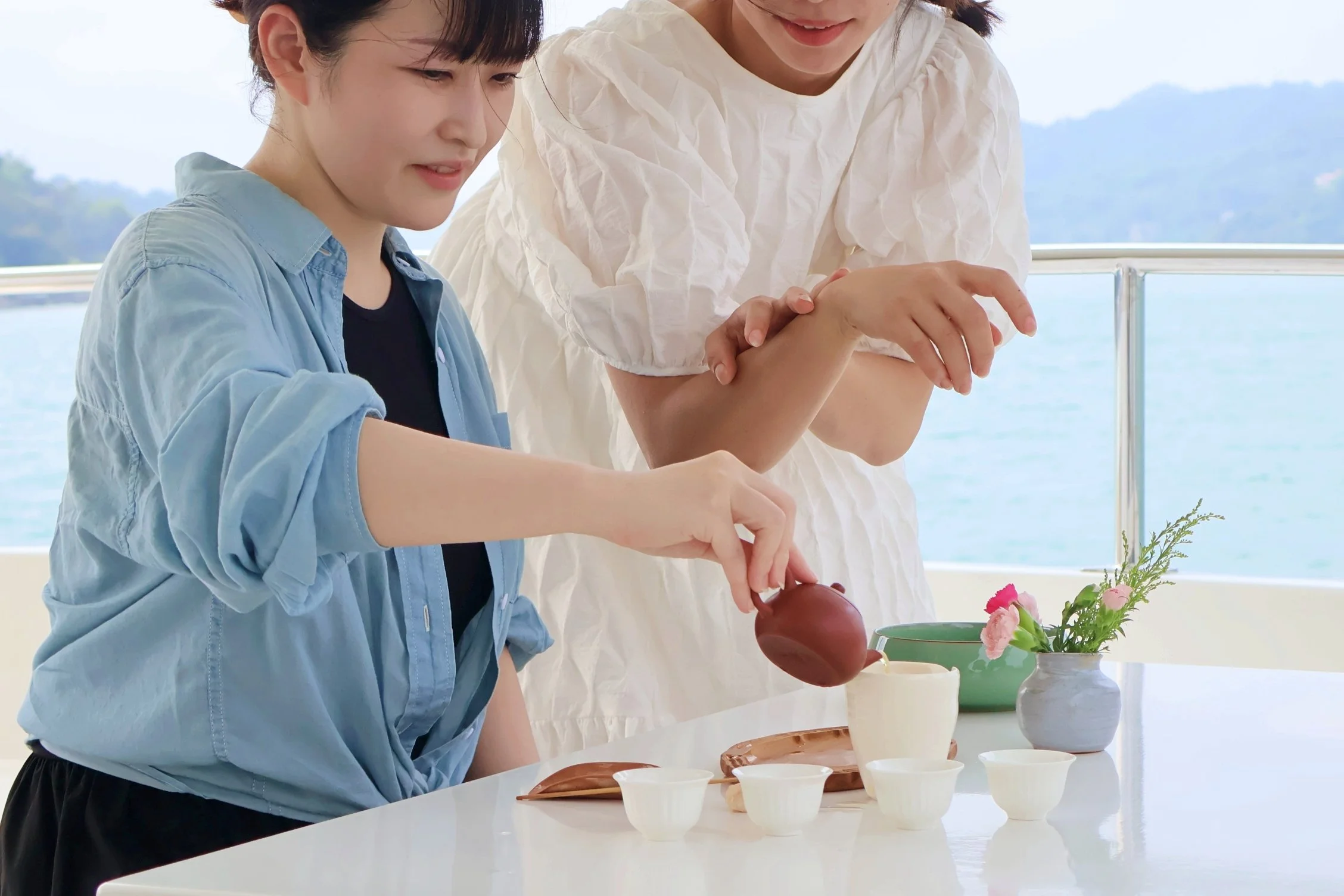 A private E-boat tea ceremony on Sun Moon Lake offers an uncrowded alternative to the lakeside crowds, paired with Sun Moon Lake's signature Ruby 18 black tea.