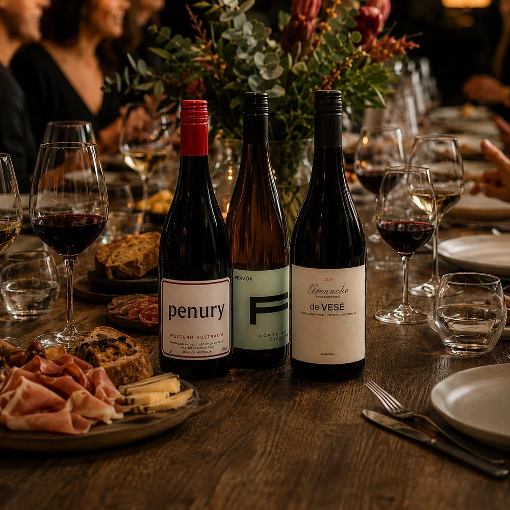 Great Southern wine bottles displayed with glasses, flowers and locally sourced food.