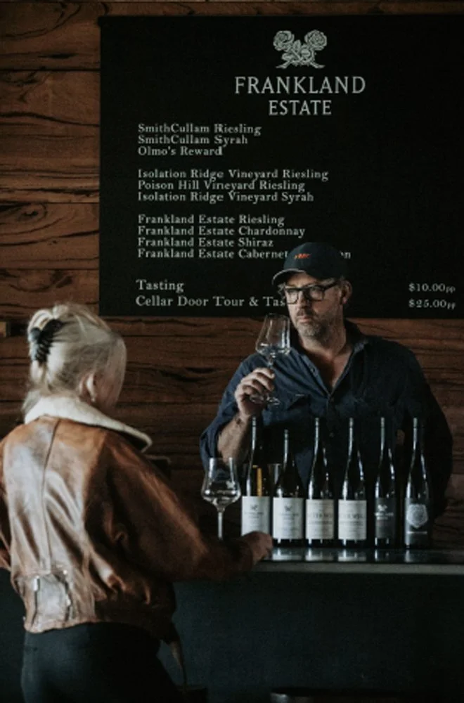 Winemaker presenting a selection of Frankland River wines to Tracey Whooley at the cellar door.