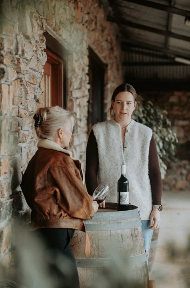 Cellar door host speaking with Tracey Whooley during a Frankland River wine tasting.