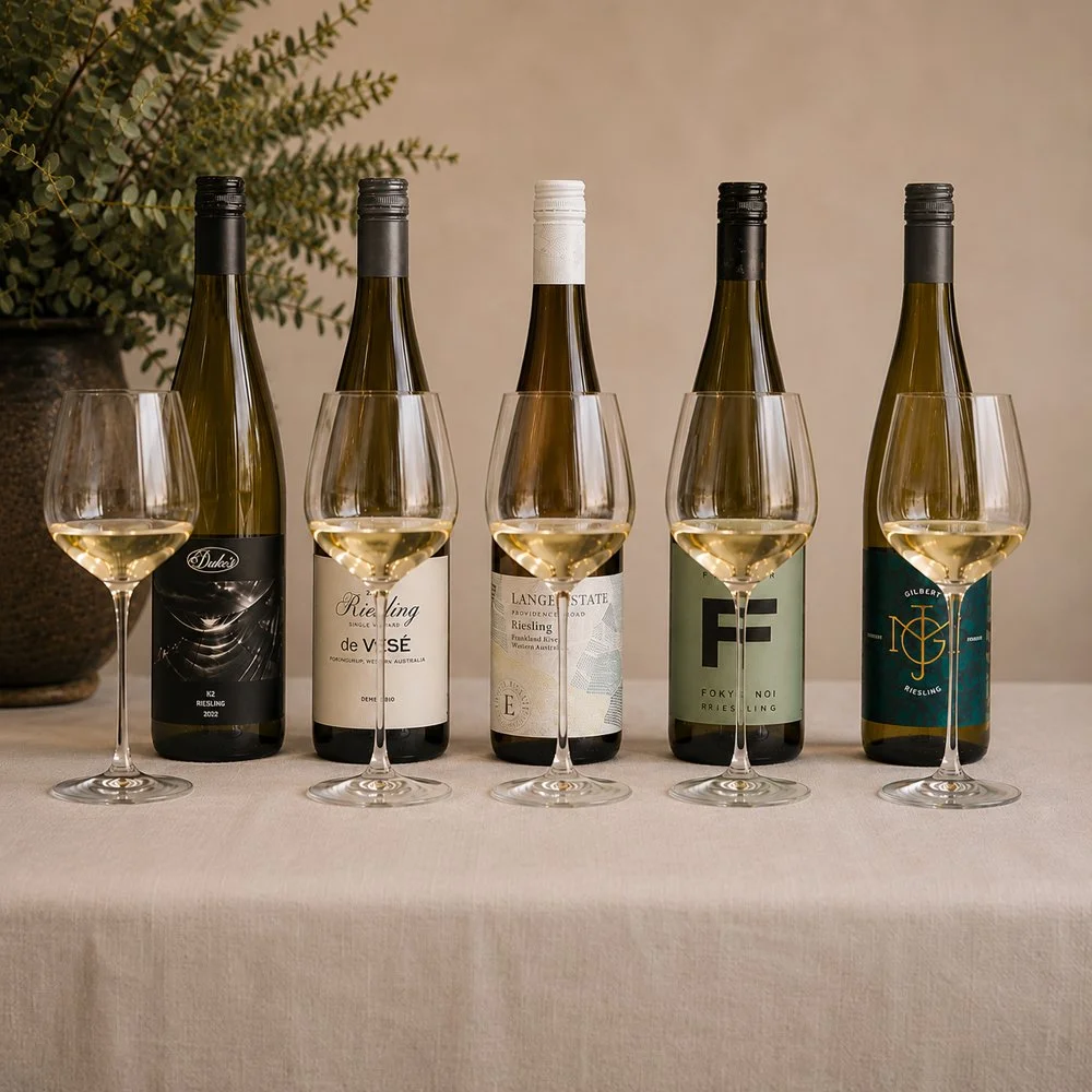 Selection of Great Southern wine bottles and tasting glasses arranged for a wine masterclass.
