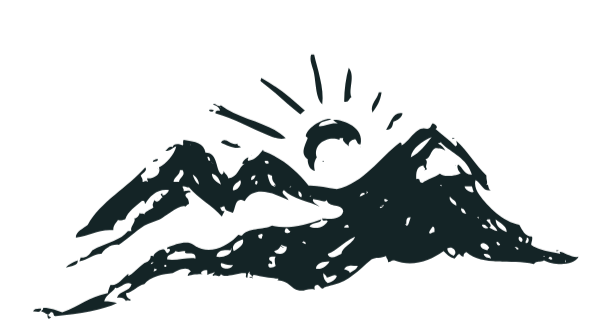 Silhouette of mountain range with sun rising or setting behind it, in dark colors.