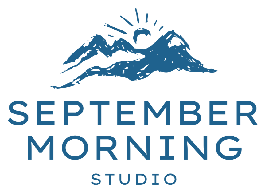 A logo featuring a mountain range with the sun rising behind it and the words 'September Morning Studio' underneath.