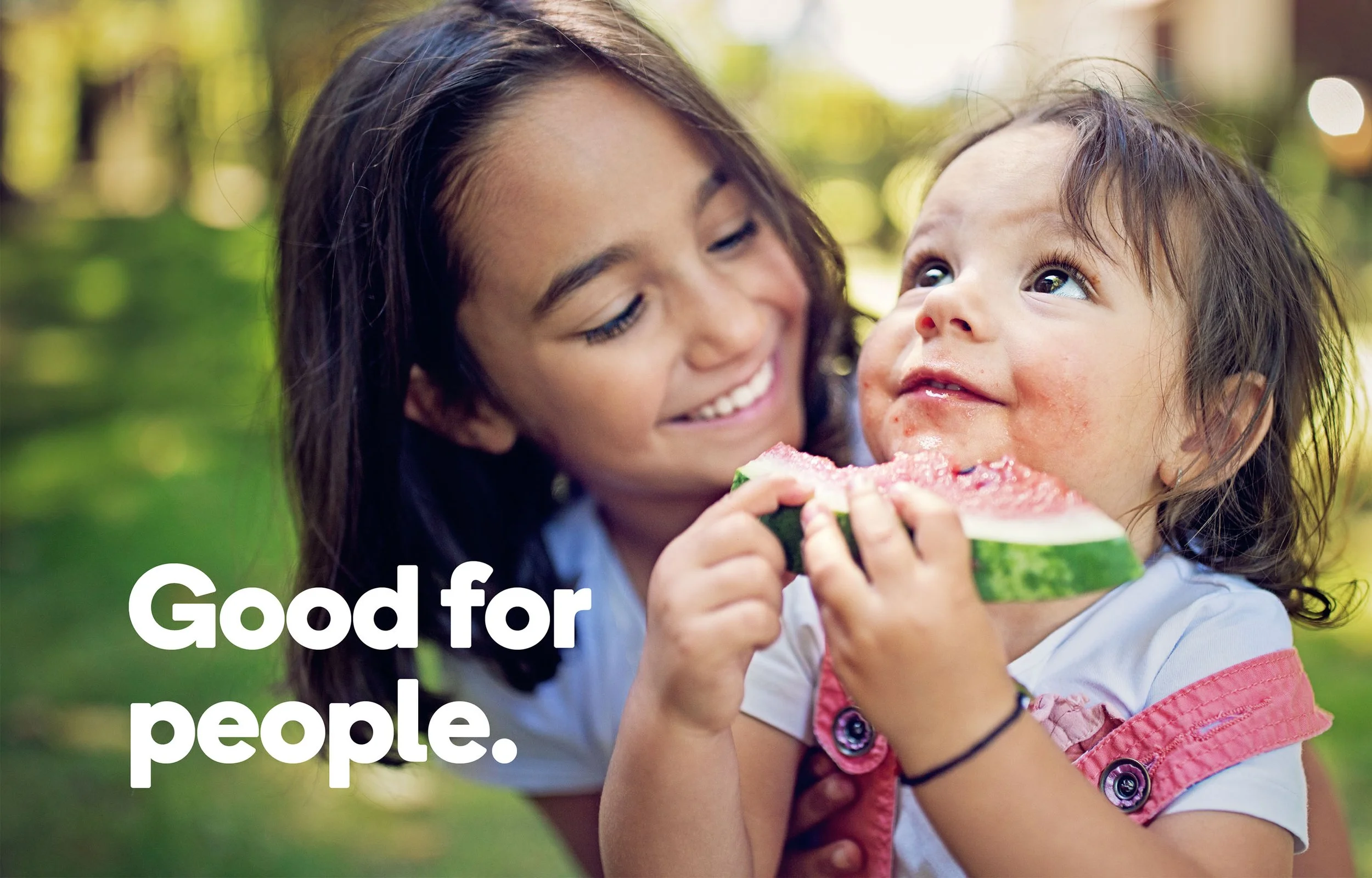 Good for People slogan with photo of a young child holding a child.