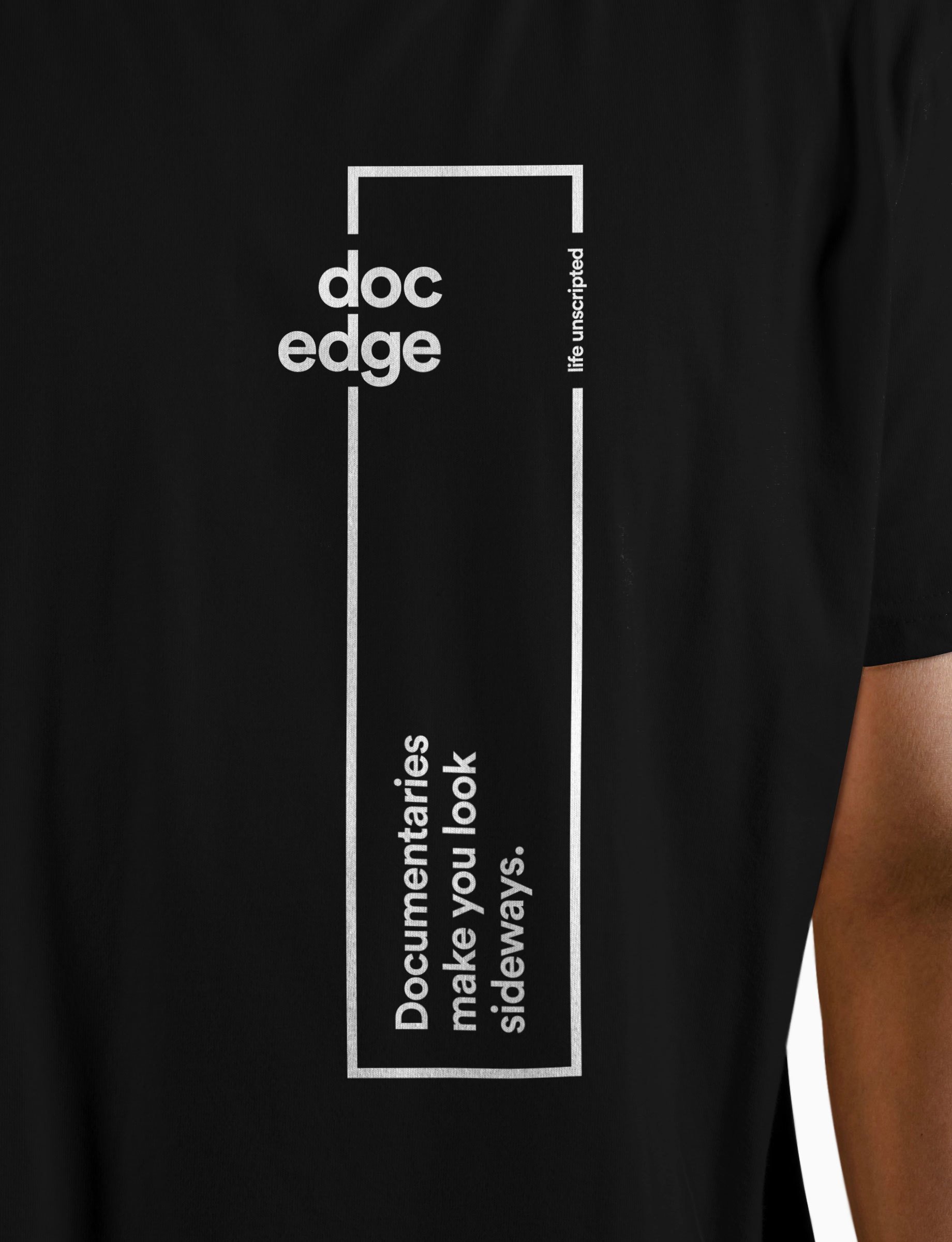Black T-shirt with white text and graphic design promoting document sideways.