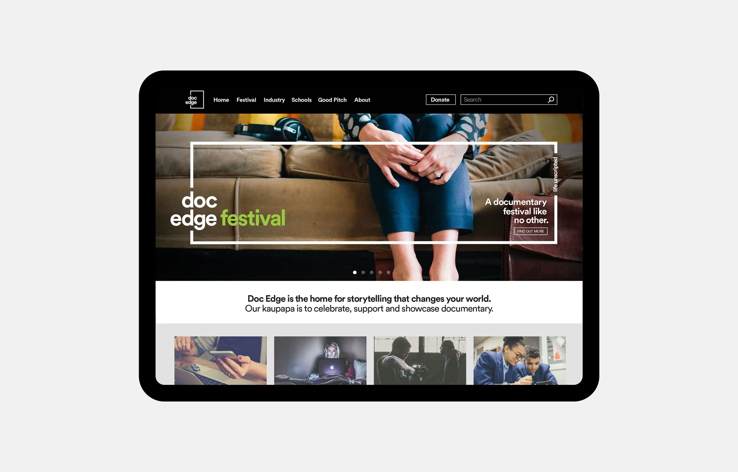 A tablet displaying the homepage of the Doc Edge festival website, featuring a woman seated with her hands on her lap, a black navigation bar at the top, and several images of people using laptops and phones below.
