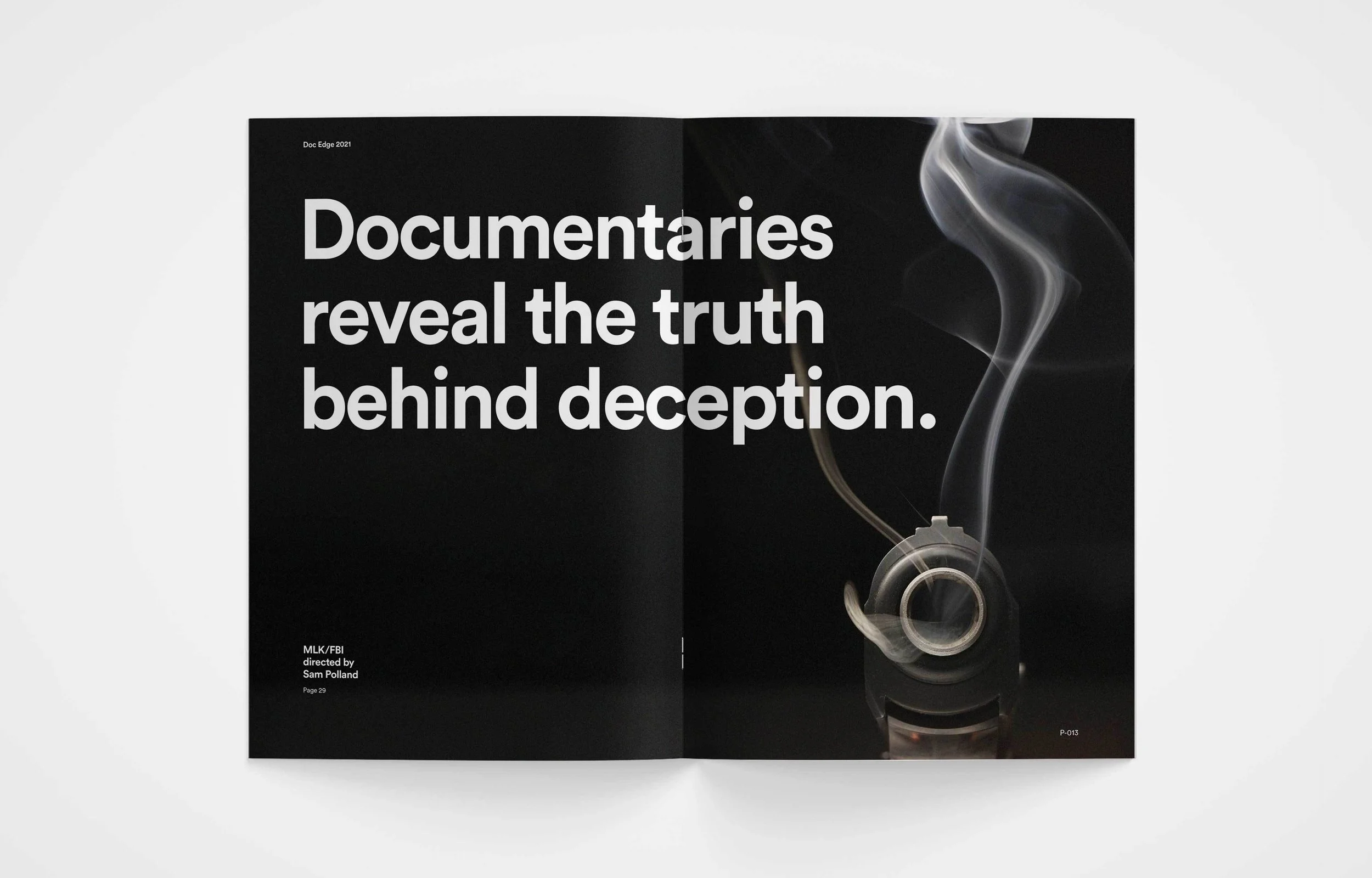 Magazine open to a two-page spread with black background. The left page has large white text stating 'Documentaries reveal the truth behind deception.' The right page features a close-up image of a smoking cigarette with gray smoke rising, also on a black background.