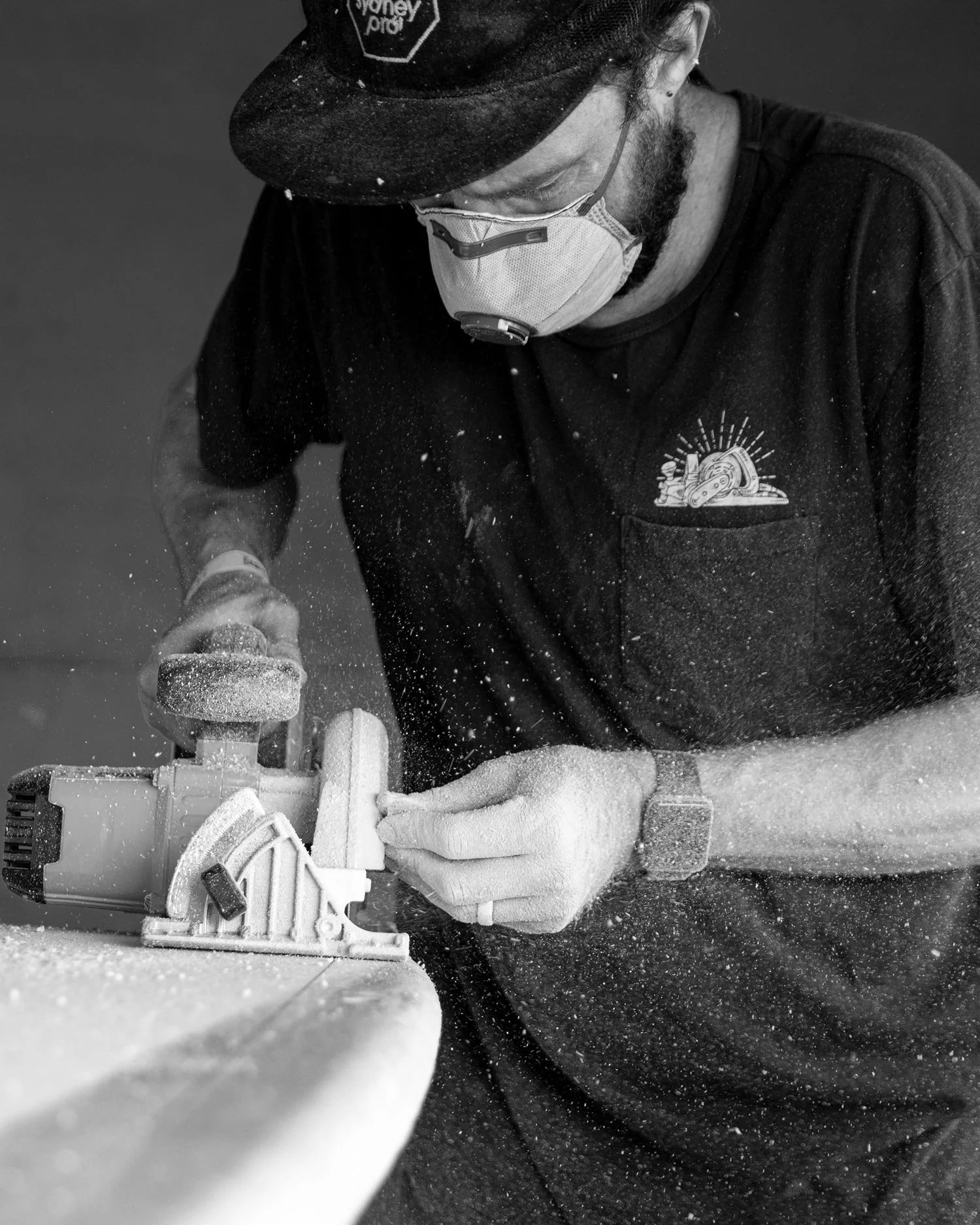 handshaping a surfboard with a planner at the Bicheno Food and Wine Festival with Aquiva and Vissla Shapers Shack