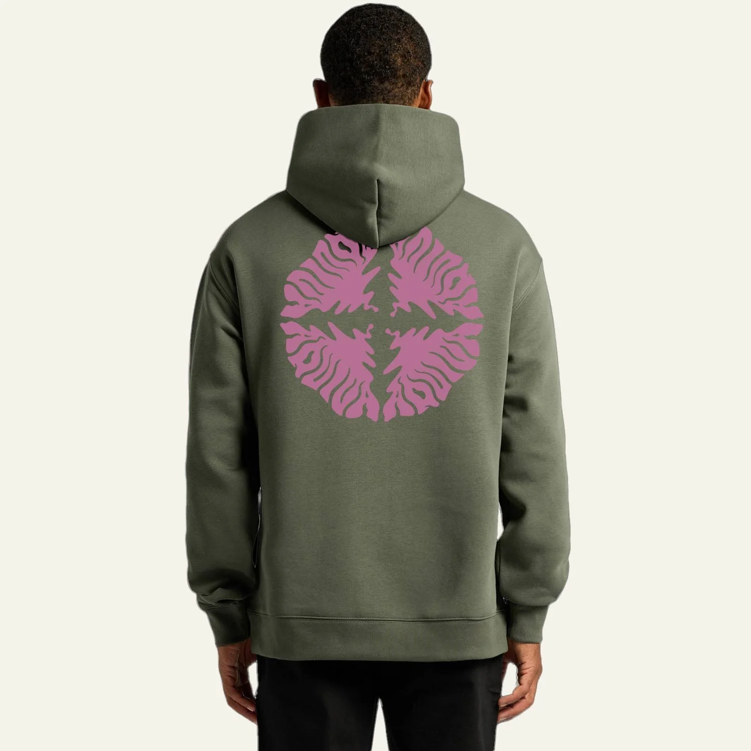 Back view of a person wearing a green hoodie with a pink circular abstract aquiva logo on the back