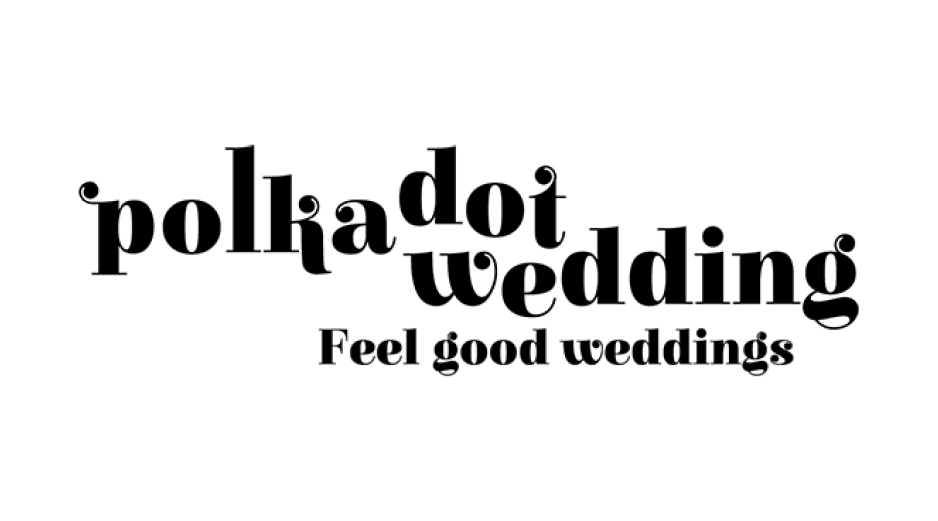 Black and white outline of a person taking a selfie with a smartphone, standing outside.