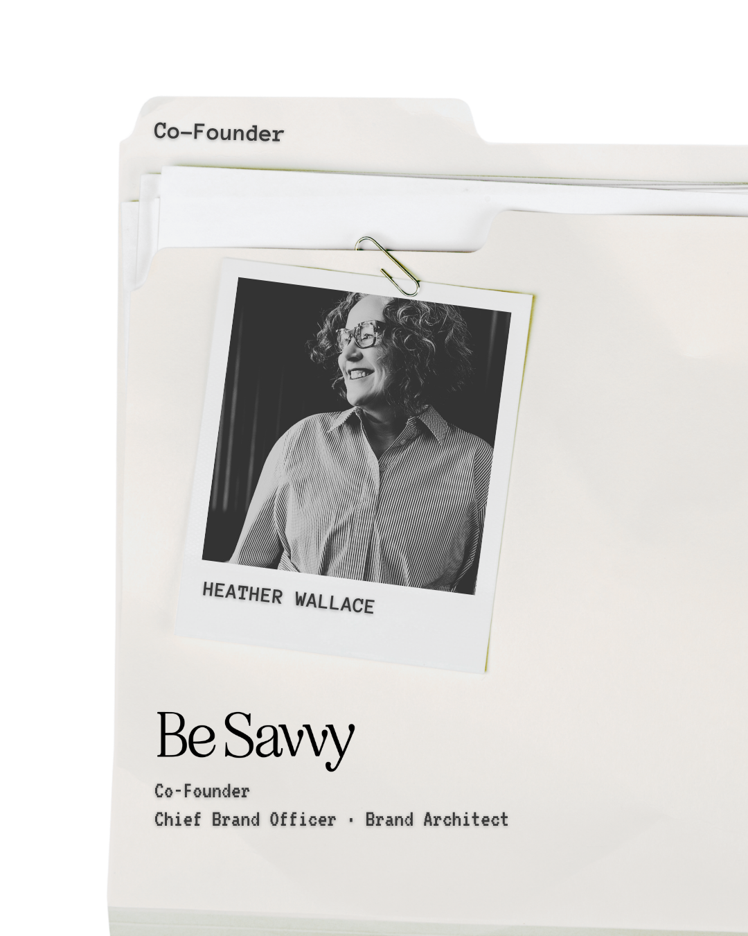 A photograph of Heather Wallace pinned to a folder labeled 'Co-Founder' with a paperclip. The folder has the text 'Be Savvy' and her titles, 'Chief Brand Officer' and 'Brand Architect'.