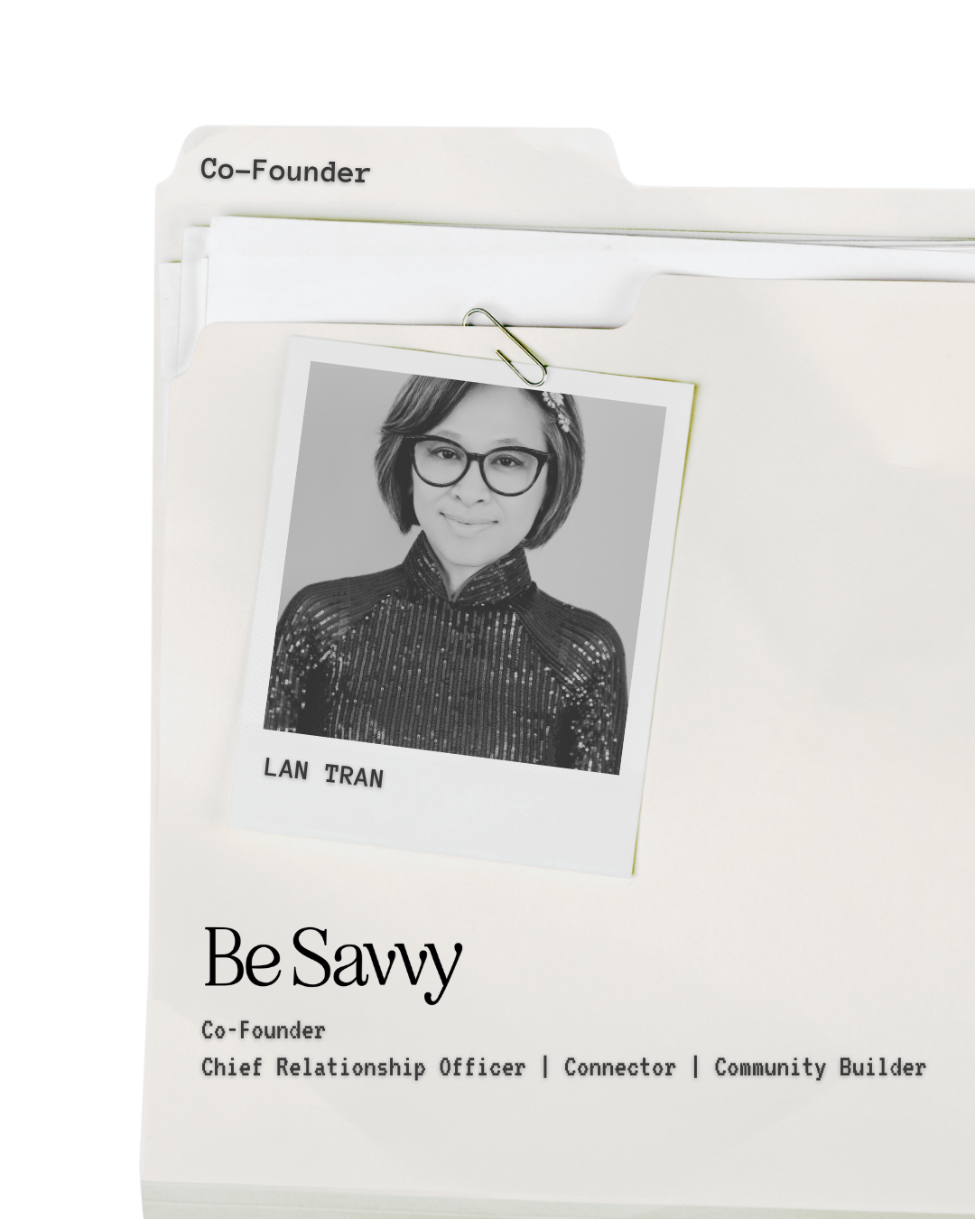 Business folder with tab labeled 'Co-Founder', containing a black-and-white photograph of a woman wearing glasses and a sparkly top. Below, text reads 'BeSavvy' and her titles as Co-Founder, Chief Relationship Officer, Connector, and Community Builder.