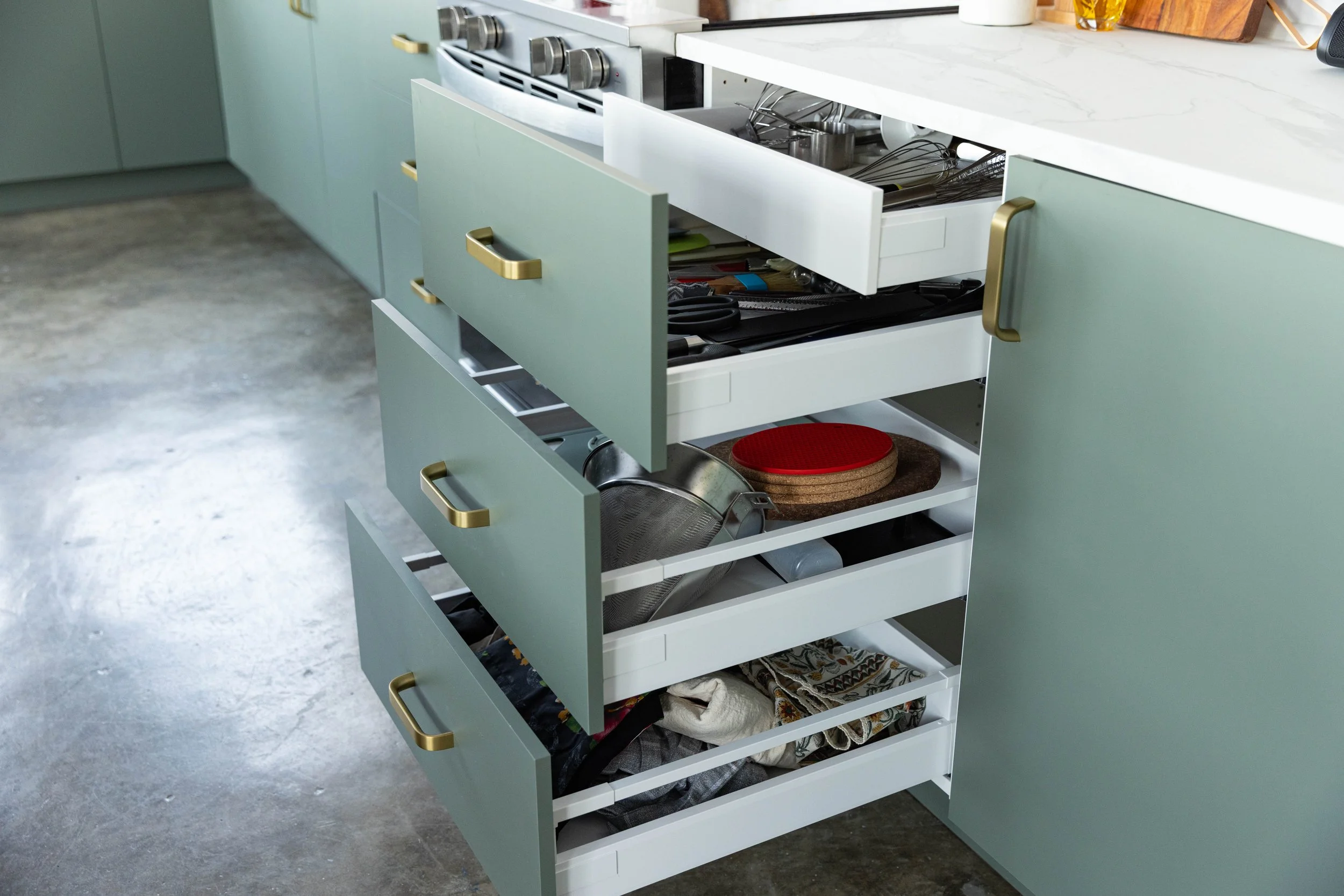 Kitchen drawers filled with cooking and baking utensils available for use in Los Angeles food photography studio.