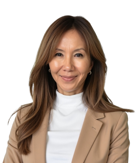 A woman with long, light brown hair wearing a beige blazer and white turtleneck smiling at the camera.