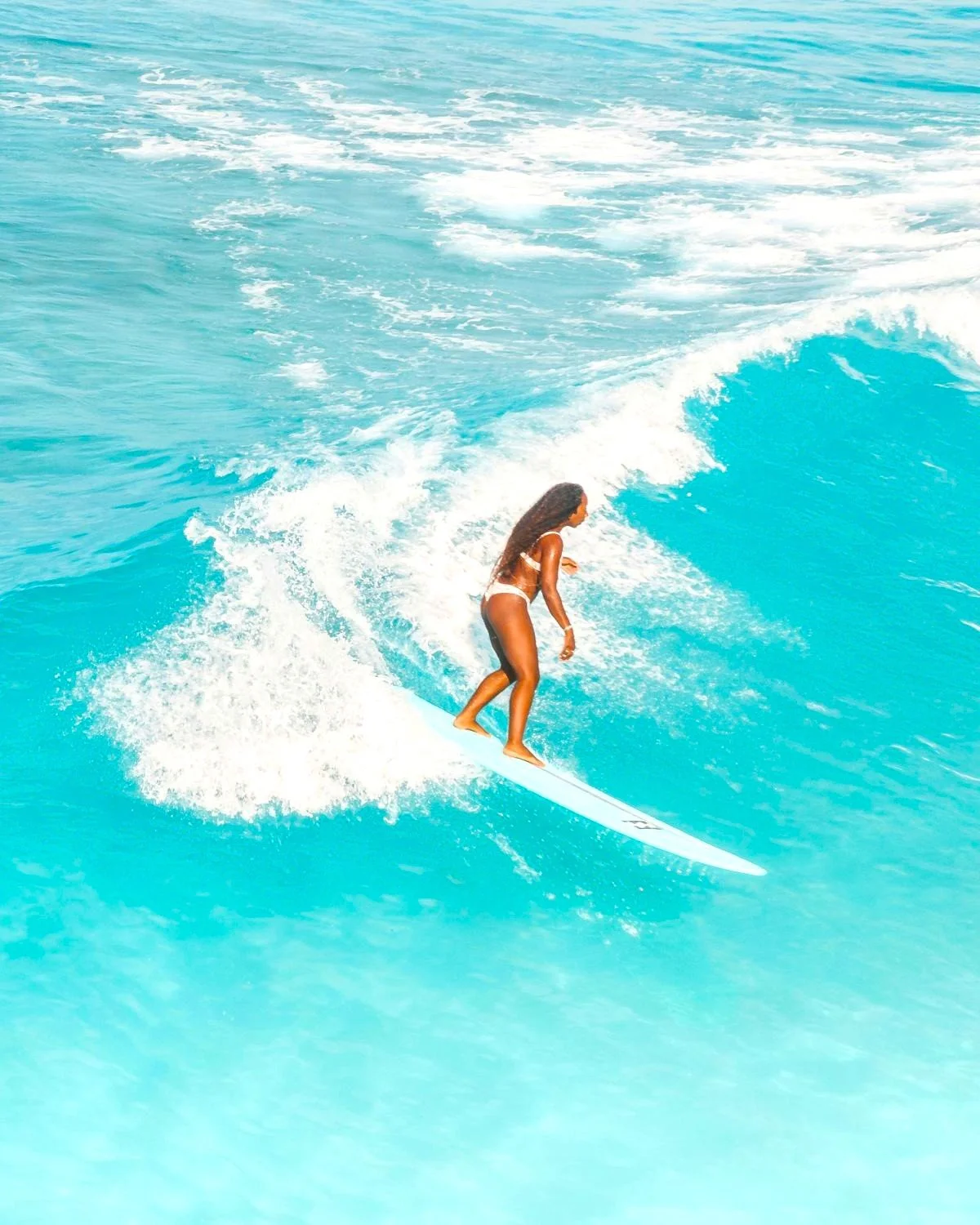 A woman surfing a wave