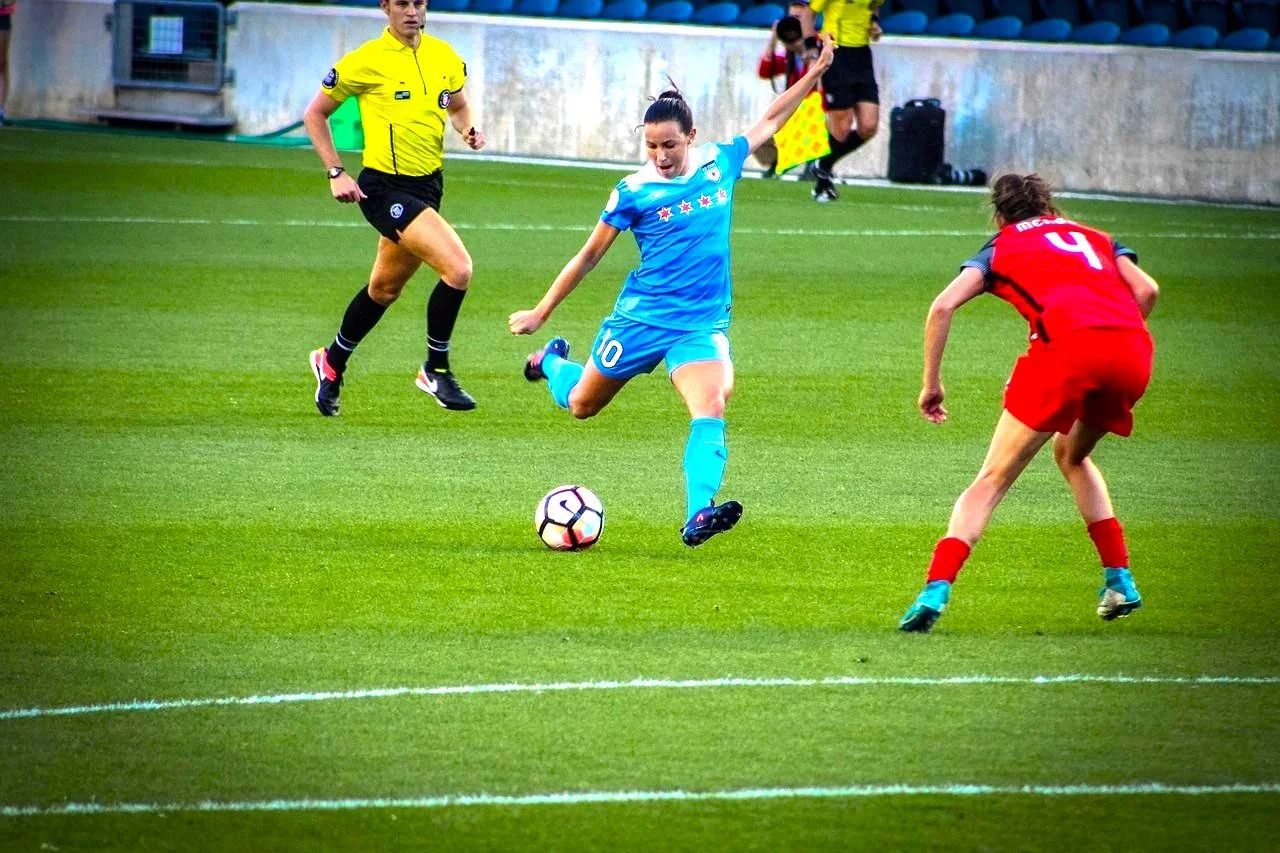 A woman playing in a soccer game