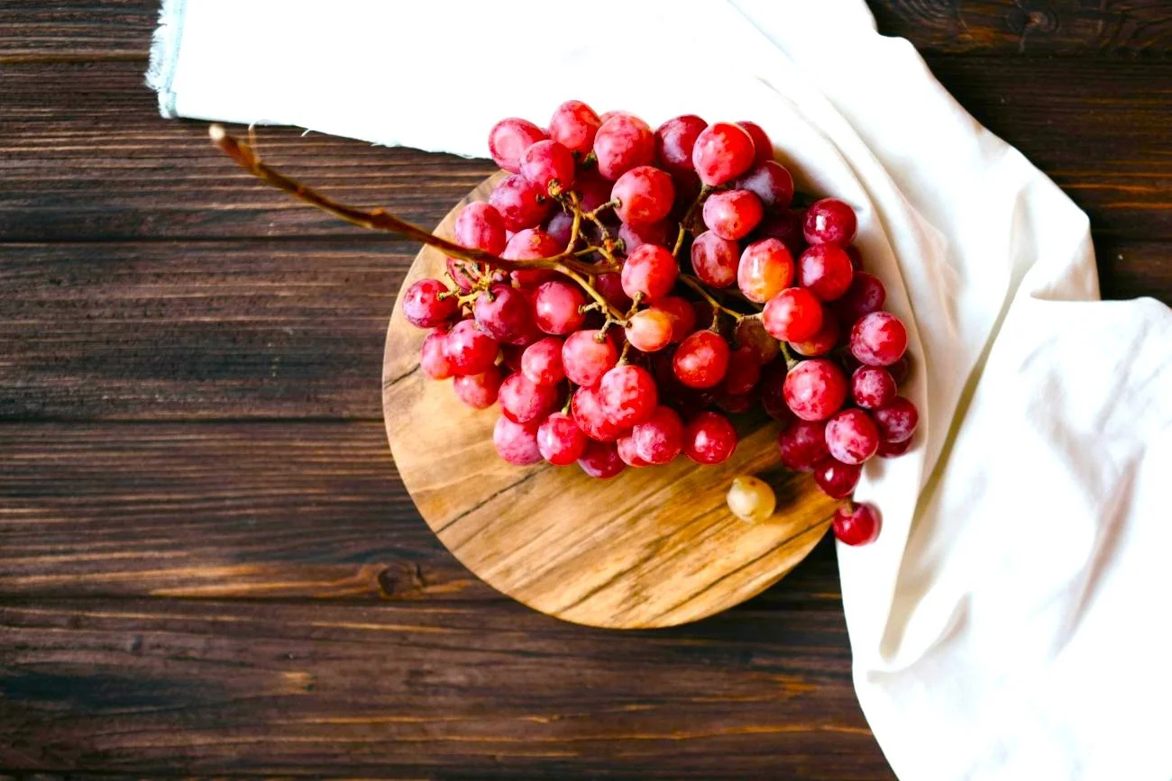 A bunch of grapes sitting on a table