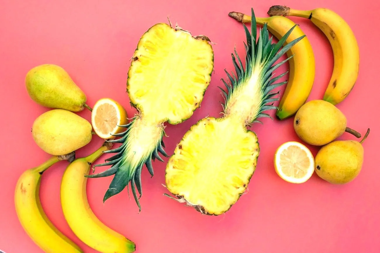 Image of various fruits on a pink background
