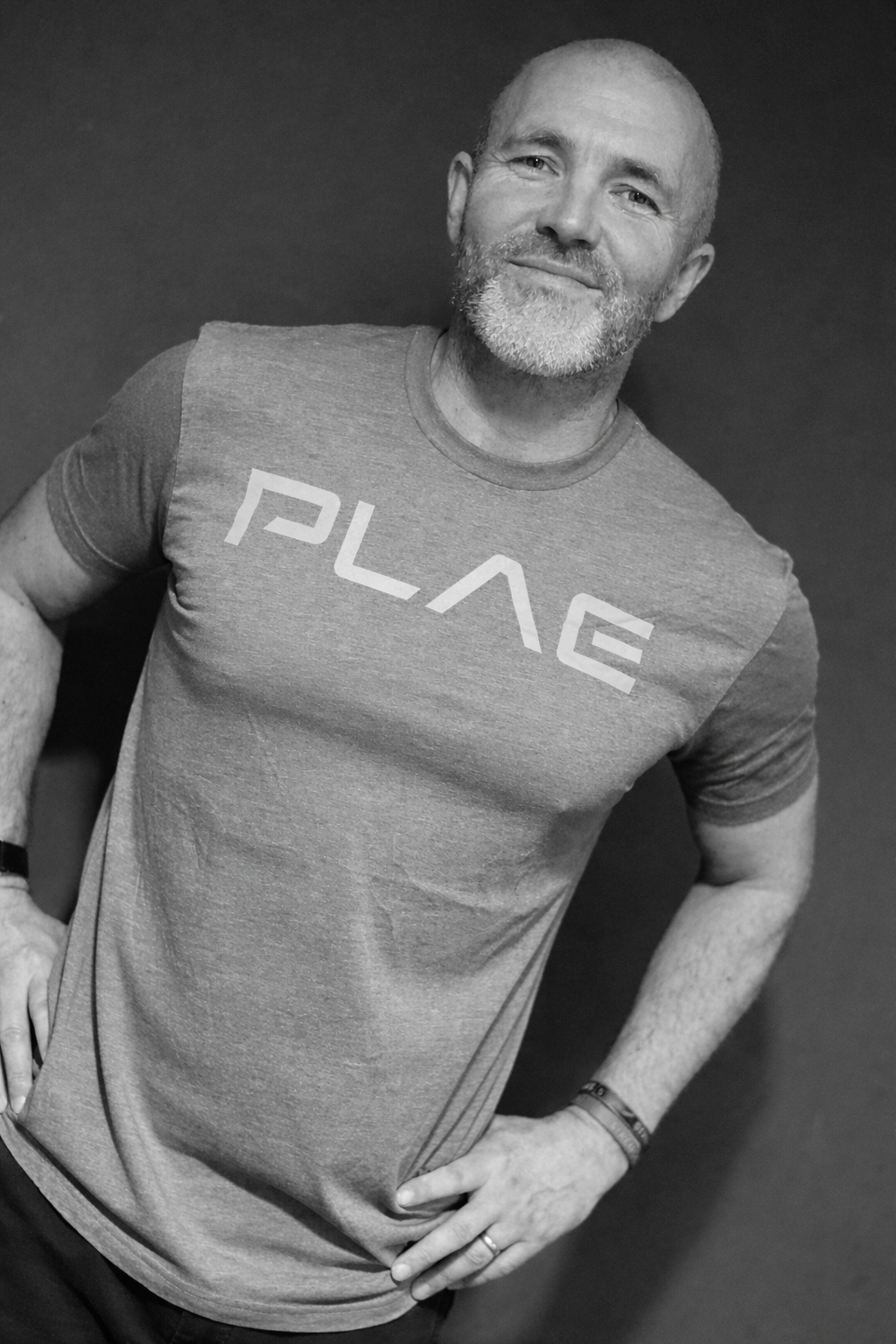 Simon Brundish sports scientist and strength and conditioning coach portrait wearing a T-Shirt by a partner brand PLAE