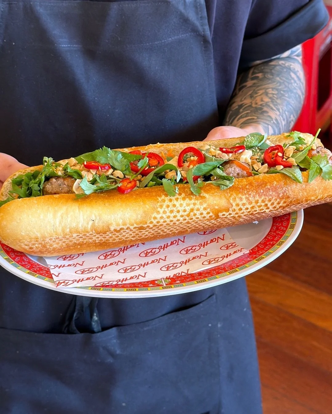 HANOI CHẢ B&Aacute;NH M&Igrave; 🥖

Grilled pork patties, chicken p&acirc;t&eacute;, Vietnamese coriander, peanuts and fermented chilli.