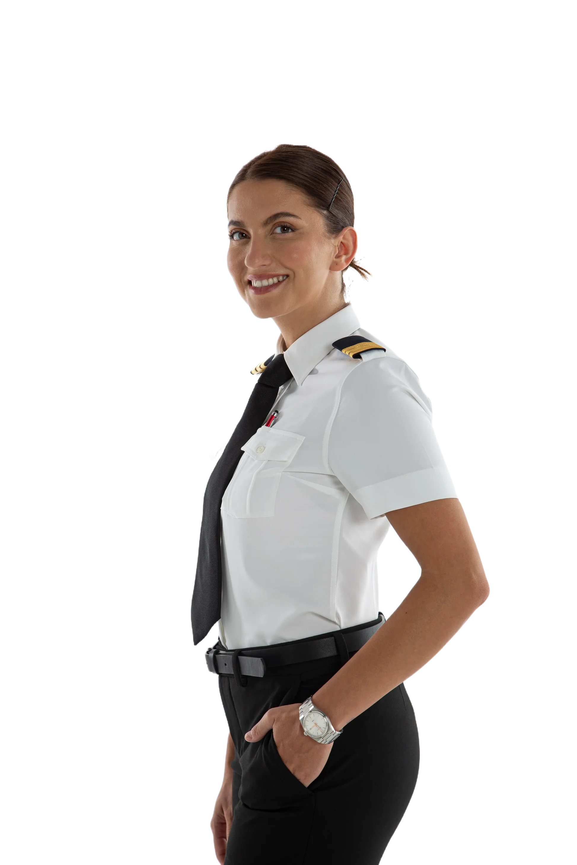 A smiling female helicopter pilot in uniform standing with her hand in her pocket