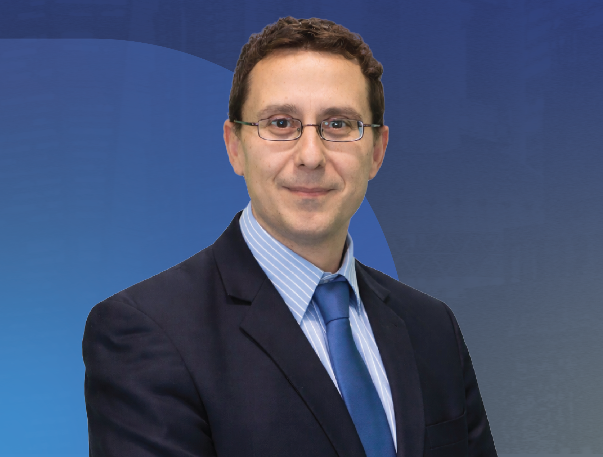 Professional portrait of Professor Dario Farina from Imperial College London in a dark suit, light blue shirt, and matching tie, standing against a blue background.