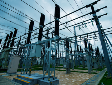 Electrical substation with transformers and high-voltage power lines.