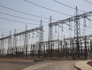 Power lines and electrical infrastructure in an outdoor substation.